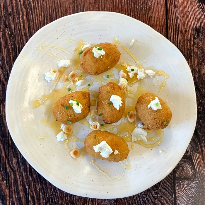 Eggplant croquette with goat cheese and honey